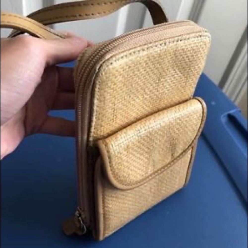 Women light brown cross body purse/wallet.